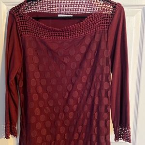 Burgundy Notation blouse. Size medium. 3/4 length sleeves with shear neckline.